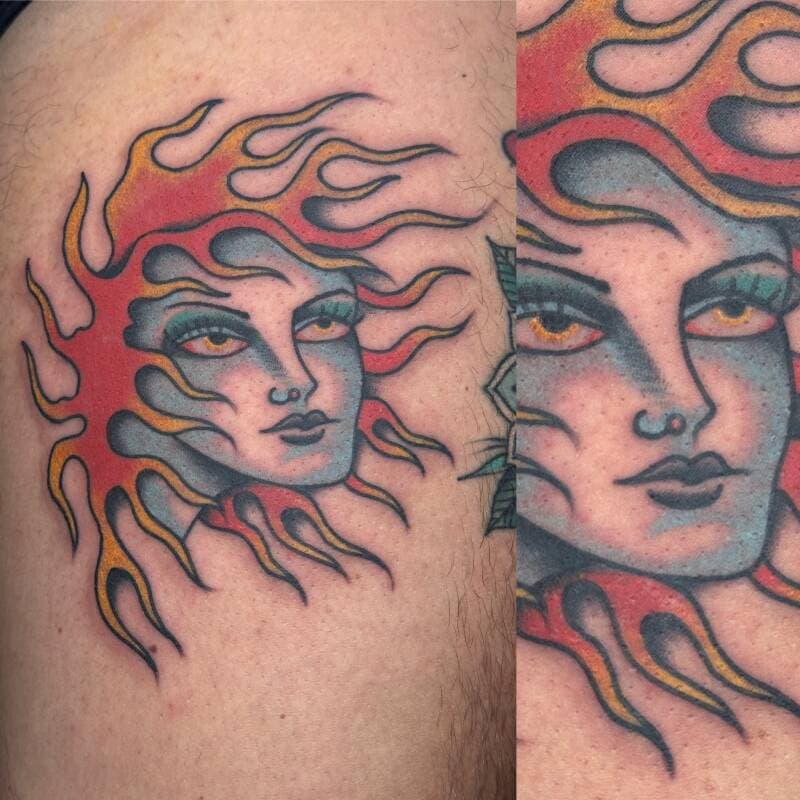 Traditional tattoo van een zon met een gezicht en vlammende haren.